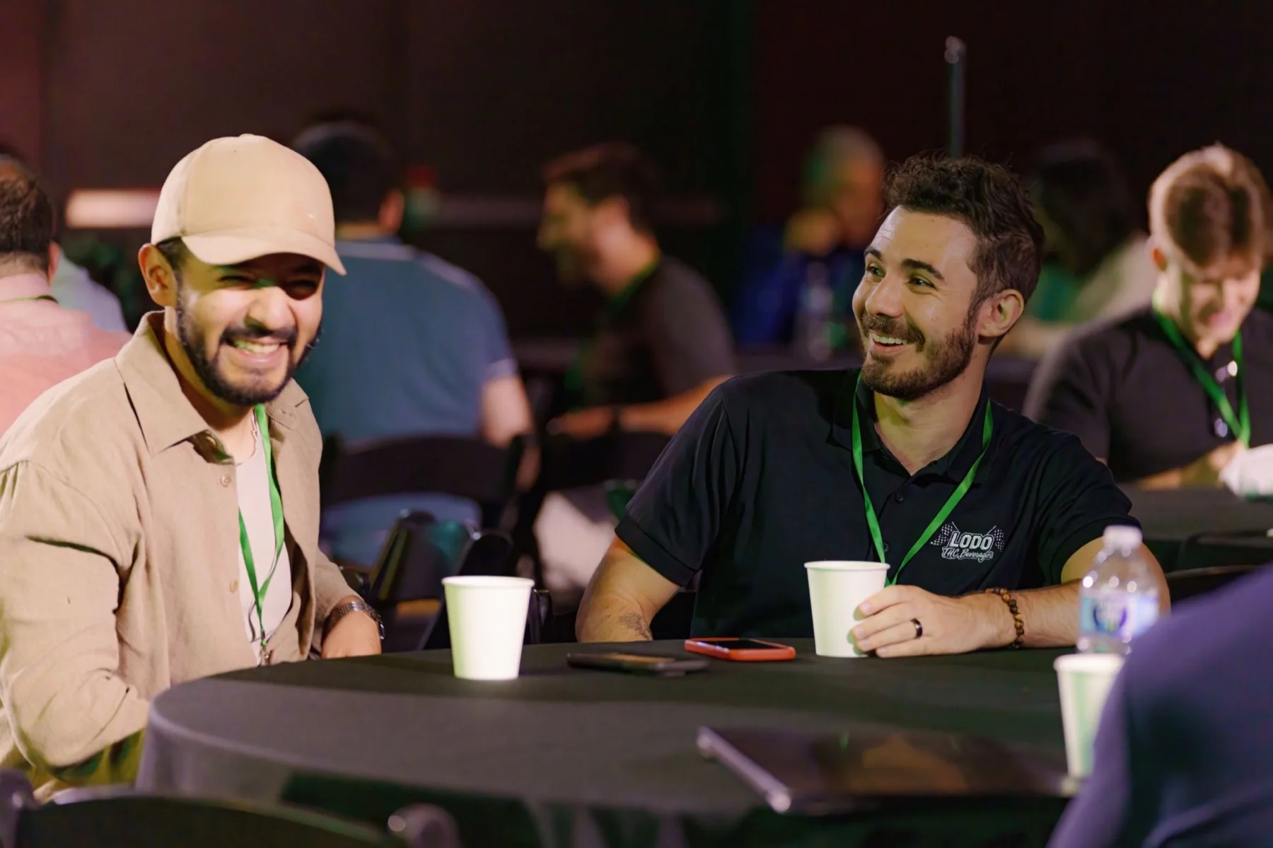Operators talking at a table during the AI Summit